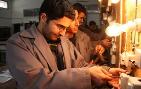 Trainee mechanic Abdullah Nam Rooti, 21, at work in Khan Yunis, Gaza