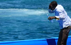 A man brushes his teeth before disembarking from the boat from Libya. The journey takes 16 hours from Tripoli to Lampedusa