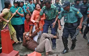 An activist is manhandled during a protest in July 2011 in Dhaka. Bangladeshi police have often been accused of heavy-handed tactics