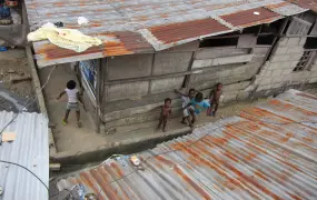 Children play in the street at Bundu waterfront, one of the sprawling shanty towns in Port Harcourt, Nigeria