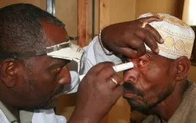 A patient gets his eyes checked for trachoma at a clinic in Ethiopia