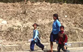 A group of school children near Nepalgunj take the long way to classes in the wake of a week of strikes by disgruntled ex Maoist combatants