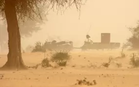 A man carts a precious drum of water through a sandstorm in Tillaberi region in southwestern Niger