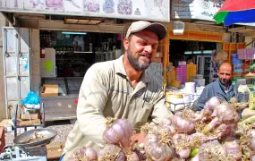 Mahmud al-haj at work in the Ramallah vegetable market