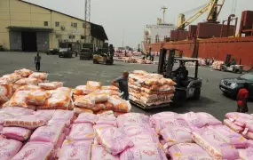 Rice prices in Cote d'Ivoire are still very high, but government attempts to fix prices are being resisted by traders. Imported rice at the port in Abidjan