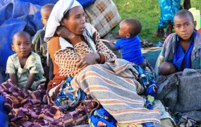 A Congolese refugee woman and her children at Nyakabande transit centre, Kisoro district, Uganda. May 2012