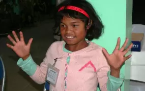 Mbolatiana Rasoamanalina, 8, learning sign language in preparation for admittance to school