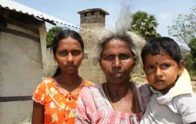 Thangeswary Karuppaiyah, 55, has lived in transitional housing since 2009. The grandmother and recent returnee to Kilinochchi District now wants to rebuild the house behind her