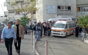 An ambulance carrying injured Palestinians in preparation to take them from Shifa hospital, Gaza, to Egypt for urgent treatment