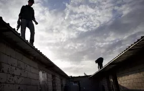 Cement block t-shelters for Syrian refugees being constructed with help from the Danish Refugee Council, UNHCR's partner in Lebanon,  near a mosque in the town of Aarsal, in Lebanon's Bekaa Valley, Nov 6, 2012.