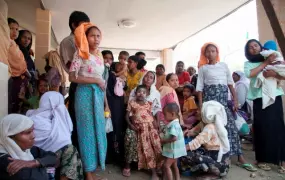 Hundreds of Rohingya IDPs in Rakhine State wait outside this makeshift clinic outside Sittwe, which has only a dozen cots and limited stores of medicines. Health workers predict rising cases of sickness and disease with the onset of the monsoon season. 
