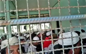 Looking inside a crowded immigration detention centre (IDC) Phang Nga Province, southern Thailand, where 276 Rohingya men are now being kept and where conditions remain poor. [June 2013]