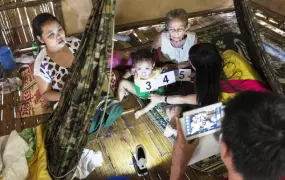 Mae Fah Luang Foundation staff verify individual biodata inside a household as part of the pilot refugee survey in Mae La camp undertaken in June 2013