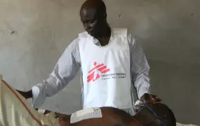 A MSF nurse stabilizes a patient at hospital in Tissi town prior to medical evacuation of the patient to ICRC surgical facility in Abéché. The town of Tissi is located in the remote south east region of Chad where MSF has set up an emergency response to