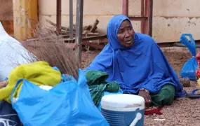 A Malian woman sits at a bus stop in Gao town, in the north of the country. She arrived from the capital Bamako where she had sought refuge following the Islamist occupation and a subsequent intervention to dislodge the rebels