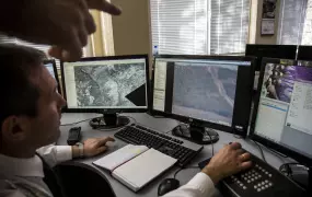 Daniel Dechev, director of surveillance for the Bulgarian border patrol demonstrates how an integrated system of sensors and cameras helps detect irregular border crossings, enabling police to apprehend people. Greece's completion of a new border fence al