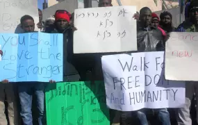 African asylum seekers demonstrating outside Israel's parliament in Jerusalem shortly before being arrested and returned to a new "open" holding facility in the southern Negev desert