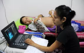 An expectant Burmese mother receives an ultrasound at the Mae Tao clinic, a Mae Sot-based health centre that provides free care to prevent and treat maternal trauma as well as family planning services that are not readily accessible in Myanmar