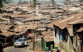 A four by four exits Kroo Bay slum in Freetown. 