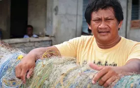 A fisherman and his nets in Leyte Province. Close to 150,000 fishermen were badly affected by Typhoon Haiyan, which devastated large parts of the central Philippines on 8 November 2013, and left over 6,000 dead