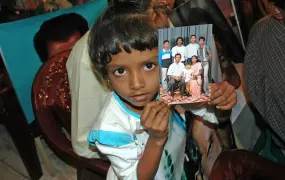 Relatives of missing persons from Sri Lanka's 26-year long civil war hold their pictures during a meeting in Sri Lanka capital Colombo.