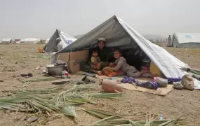 A family from Miramshah, North Waziristan inside a tent in Khost, Afghanistan.