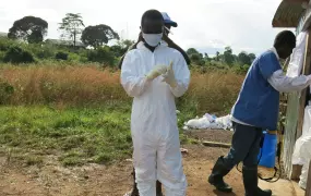 Ebola survivor Tejani Golafelay prepares to go into the Bomi Ebola Treatment Unit in Liberia to help patients. 