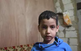 Mohammed, 7, a Syrian refugee from Homs now in Lebanon, was injured when the ceiling of the underground car park his family are staying collapsed