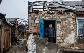 Ivan Kubarev, 61, shows the destroyed home of his elderly relatives in Triokhizbenka, who are now sheltering with him and his wife nearby.