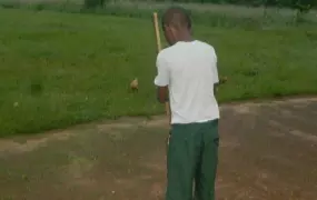 14-year-old Tony, whose parents died from Ebola last year, sweeps the courtyard outside the orphanage he now lives in. More than 16,000 children in Guinea, Liberia and Sierra Leone lost one or both their parents to the deadly virus. 