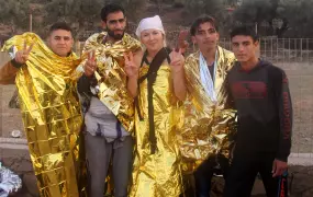 Marienna with some of the refugees she helped from their boat on her first day of volunteering on Lesvos