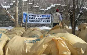 Aid workers in Pakistan's Chitral district load relief supplies in November 2015, weeks after an earthquake struck