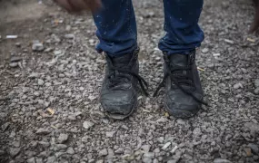 An Afghan man's broken boots, after traveling through Iran, Turkey and Bulgaria and arriving in Serbia