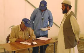 [Afghanistan] A returned refugee is checked in at Pule-e-Chakri reception centre outside Kabul.