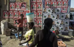 Photo of political posters at a market in Mozambique.