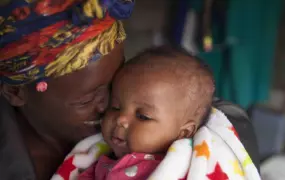 Siphiwe Khumalo, 37, and her newborn baby, Lundiwe in South Africa. Siphiwe was already on life-long antiretroviral treatment when she fell pregnant with Lundiwe.