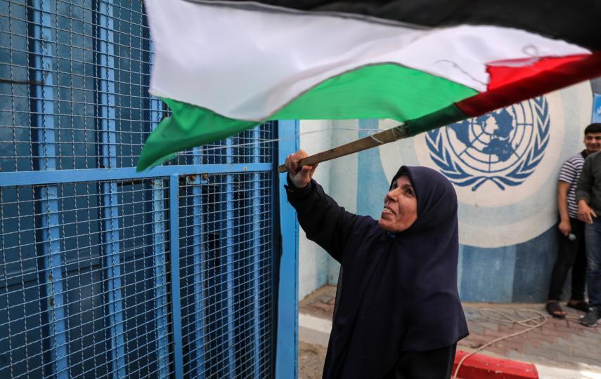 Palestinians protest delays in the reconstruction of homes destroyed in the May 2021 war outside UNRWA offices in Gaza City, on 25 April 2022.