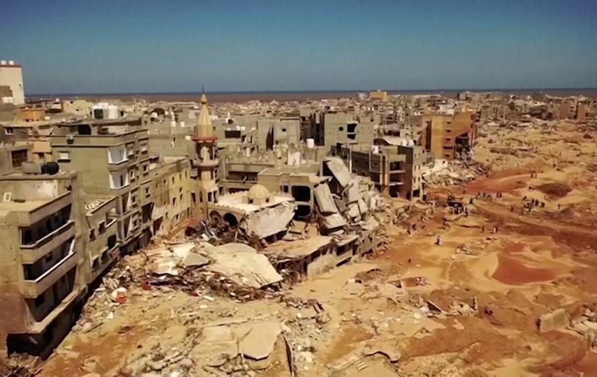 A still from an aerial video showing a destroyed Derna.