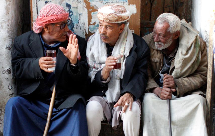 People chat as they sit at a cafe in the old quarter of Sana’a, Yemen in November 2019.