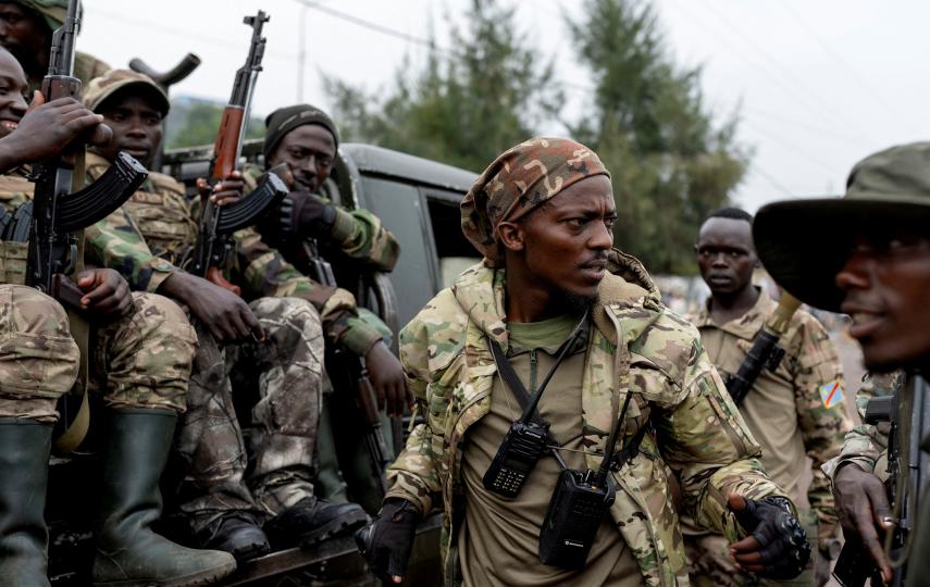 Members of the M23 rebel group on a pick-up truck in Goma, shortly after they seized the city in late January.