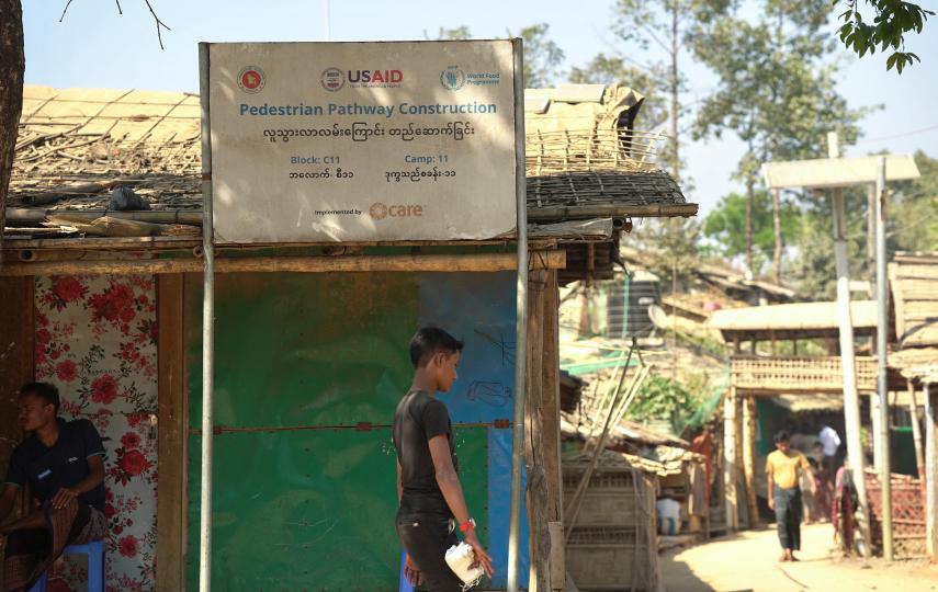 Rohingya walk along a pathway that was built with the help of USAID fund, at a refugee camp in Cox's Bazar, Bangladesh February 10, 2025.