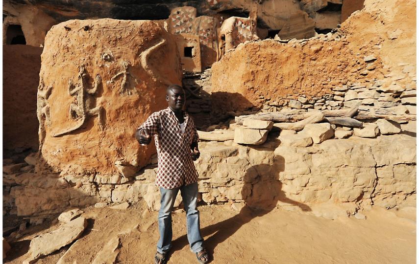 Malian journalist Mamadou Tapily speaks to tourists while working as a guide before a jihadist insurgency swept through large parts of his country from 2012 onwards.