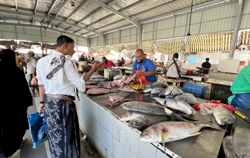 We see a man shopping at a fish market in Yemen’s coastal city of al-Mukalla.