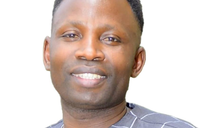 A headshot of Micheal Gumisiriza.