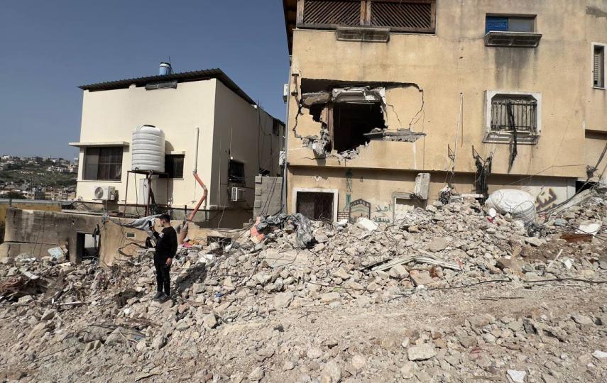 Residents of Nur Shams camp in Tulkarm inspecting their home after it was demolished by the Israeli military.