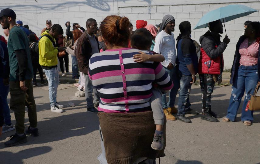 A migrant mother and baby wait outside the facilities of the Mexican Commission for Refugee Assistance in the State of Mexico, Mexico, on January 28, 2025, for an appointment.
