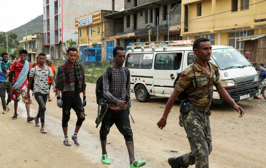 Newly recruited youth joining Tigrayan forces march through the village of Nebelet, northern Tigray, Ethiopia, July 11, 2021.