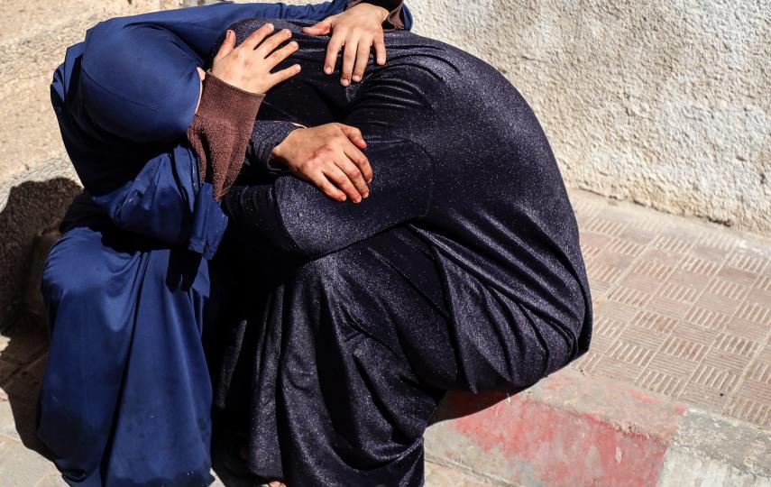 Palestinian women mourn a relative who was killed in an Israeli airstrike in Gaza City, on 7 May 2025.