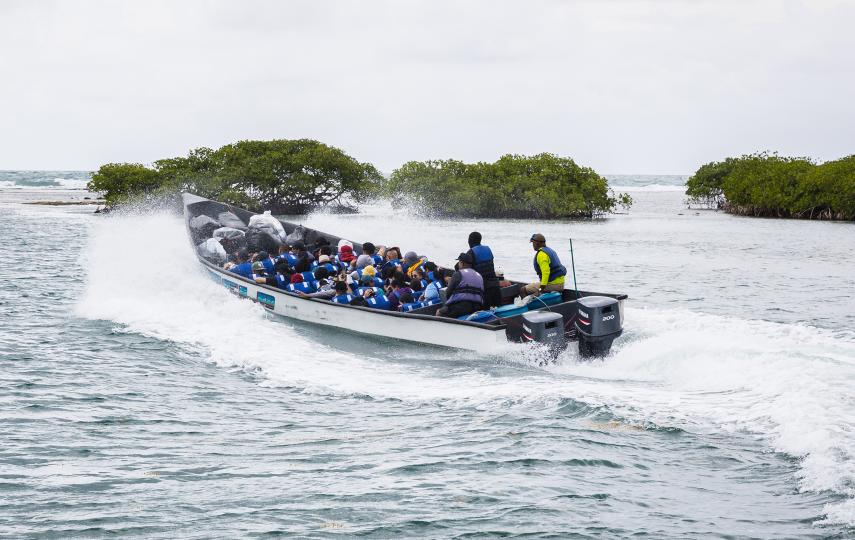 A boat departs from Miramar for Puerto Obaldía, the first stage of a three-day journey from Panama to Colombia that has become one of the main cross-continental routes for reverse flow migrants, on 11 April 2025.