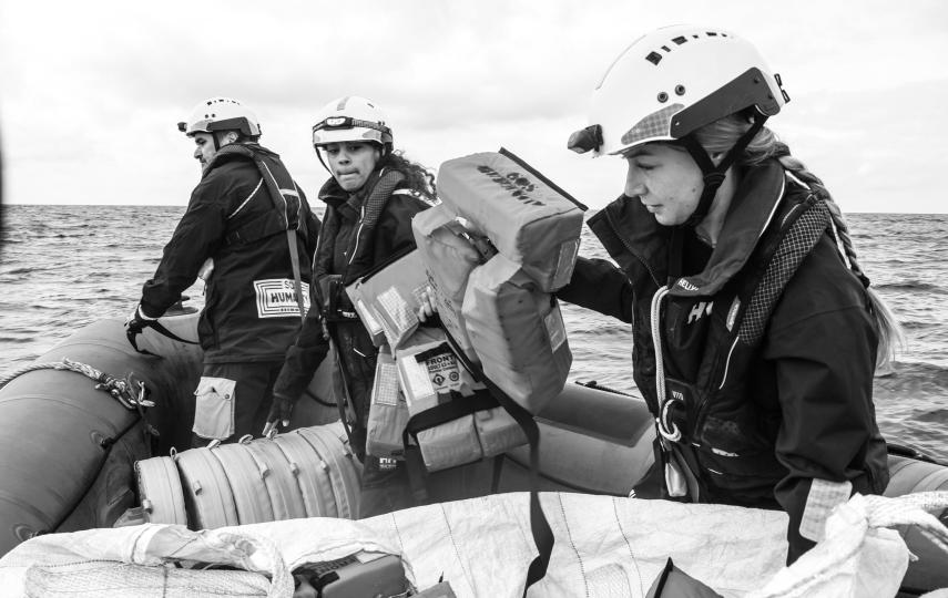 Volunteers training on Bravo, a small, inflatable boat used to conduct rescues in the central Mediterranean Sea.